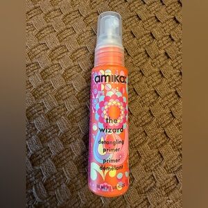 amika The Wizard Detangling Primer Spray — Pink and Orange Floral Bottle